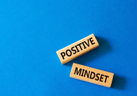 blue background and two rectangular blocks with Positive and Mindset