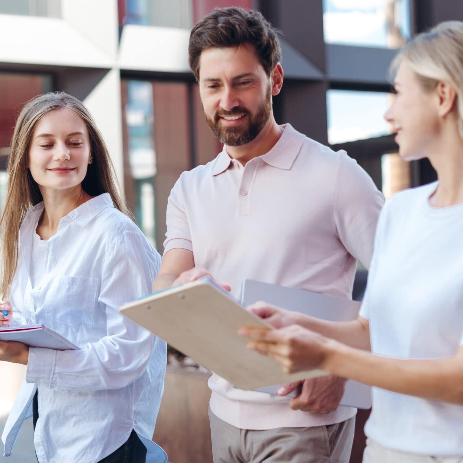 Professional,Team,Of,Young,Coworkers,Walking,And,Discussing,A,Project