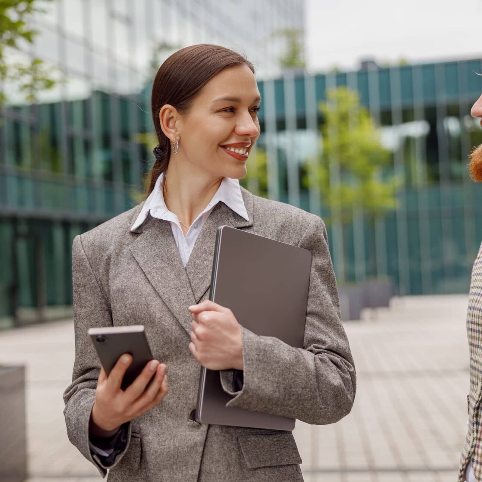 Two,Professionals,Dressed,In,Business,Attire,Are,Engaged,In,Exchanging