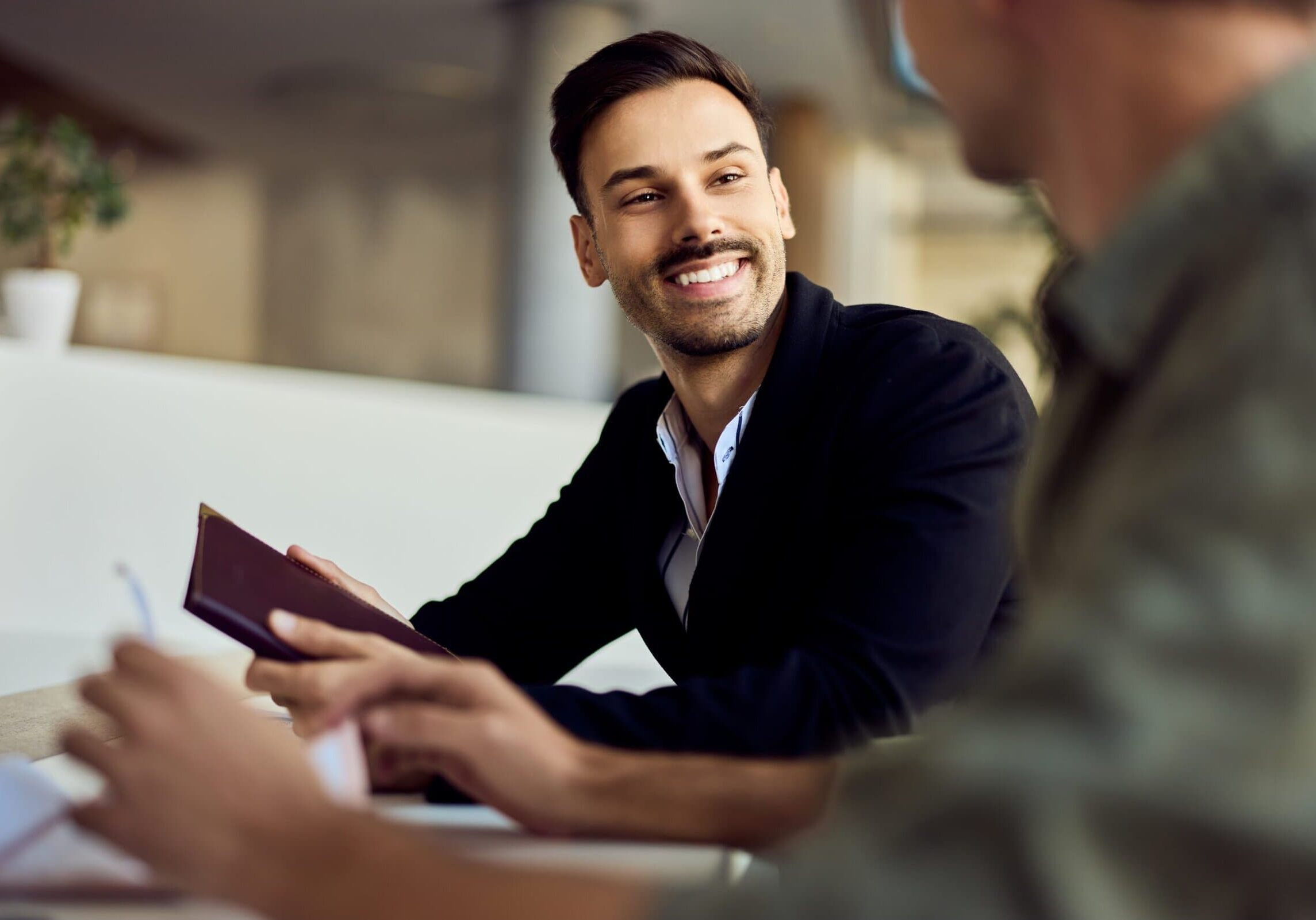 Confident,Professional,Conversing,Warmly,During,A,Business,Meeting,In,An