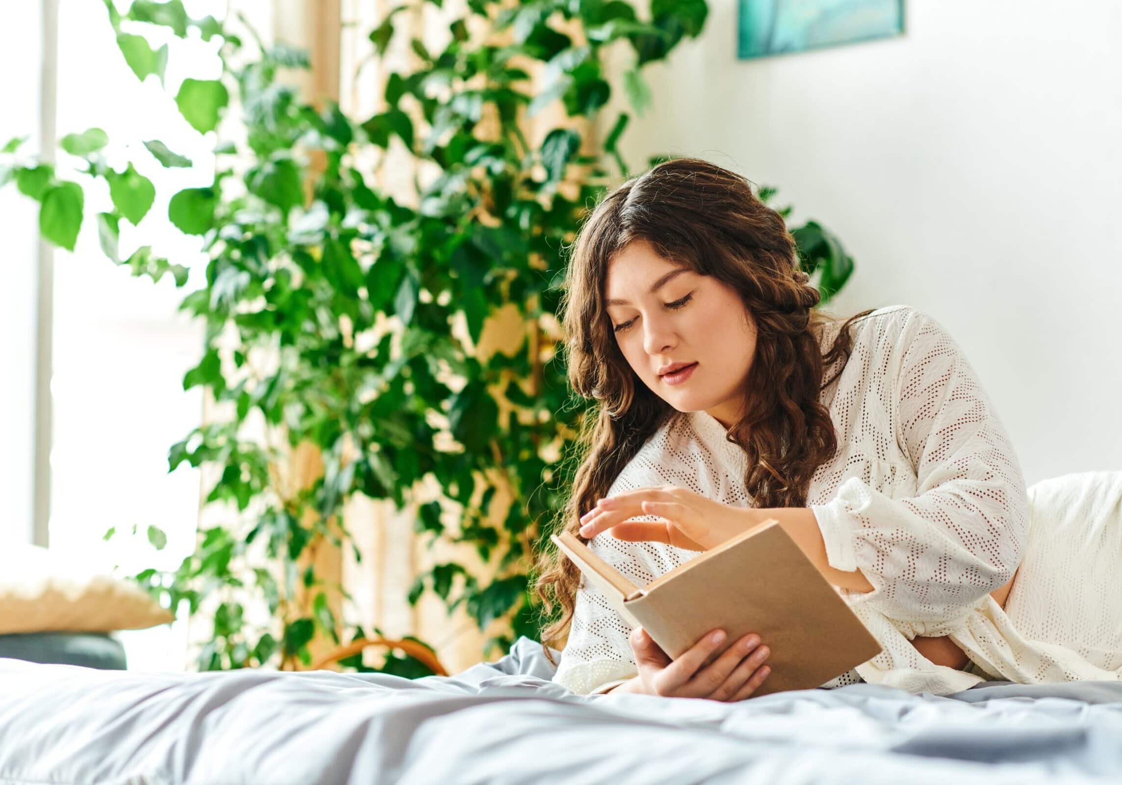 A,Beautiful,Young,Plus,Size,Woman,Relaxes,While,Reading,A