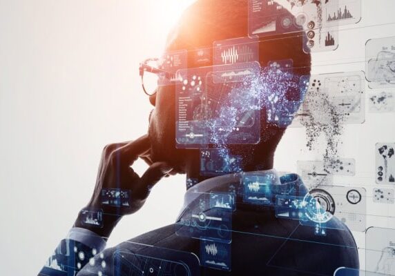 man pondering with overlay of technological drawings