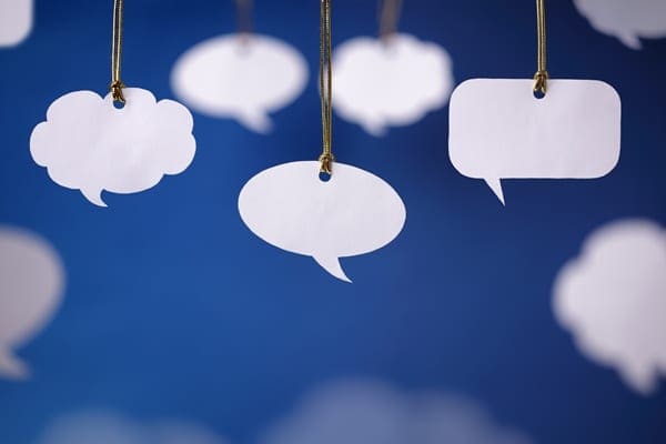 speech bubbles tied on strings hanging
